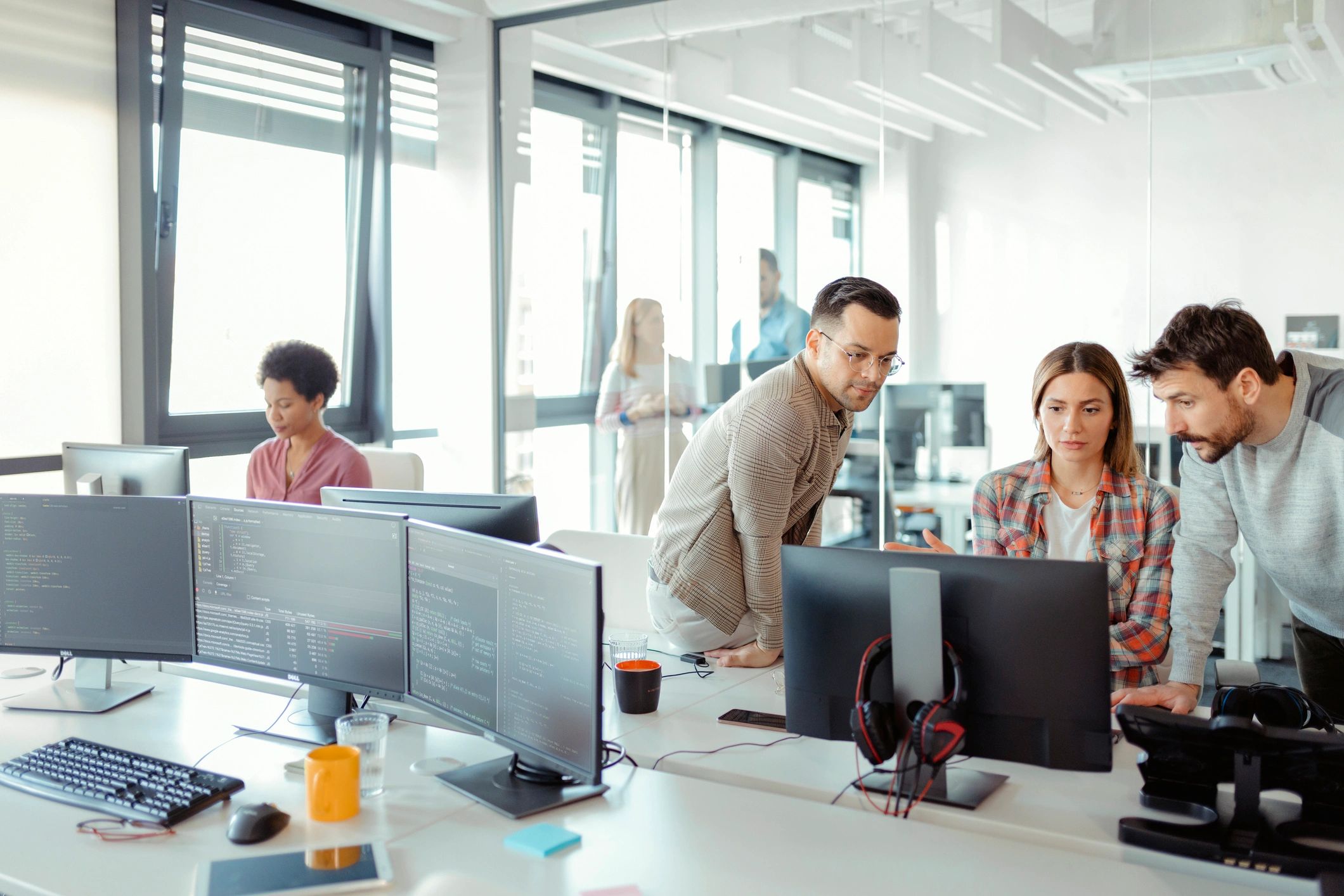 Engineers and developers brainstorming in a modern workspace