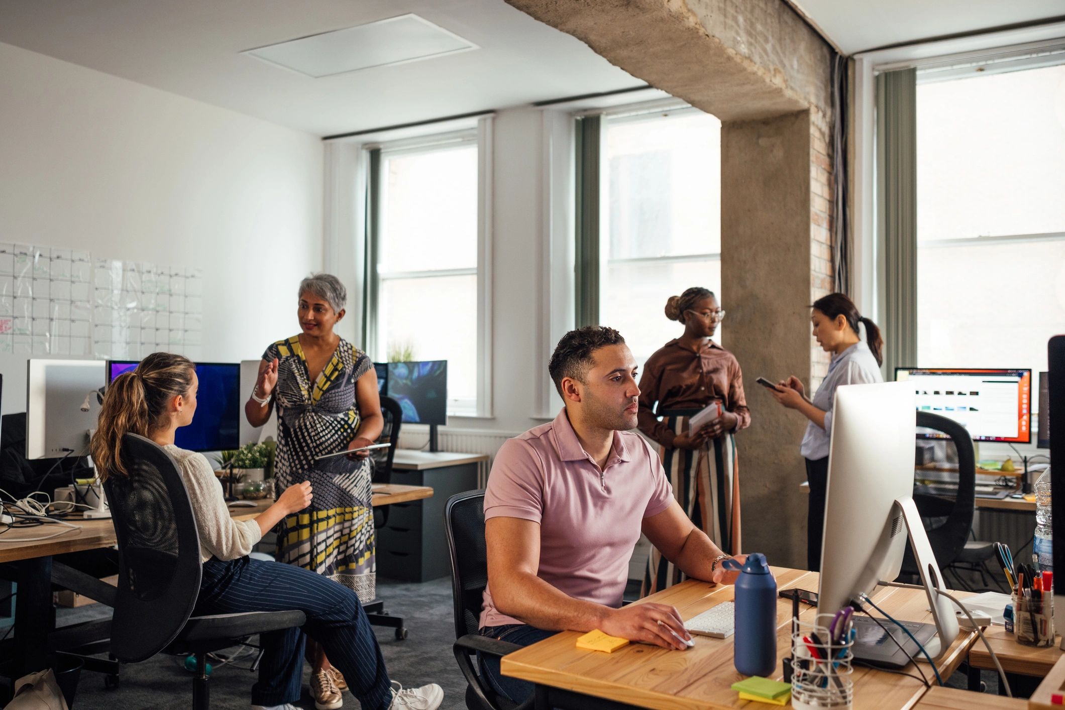 Technology team working together in a modern office