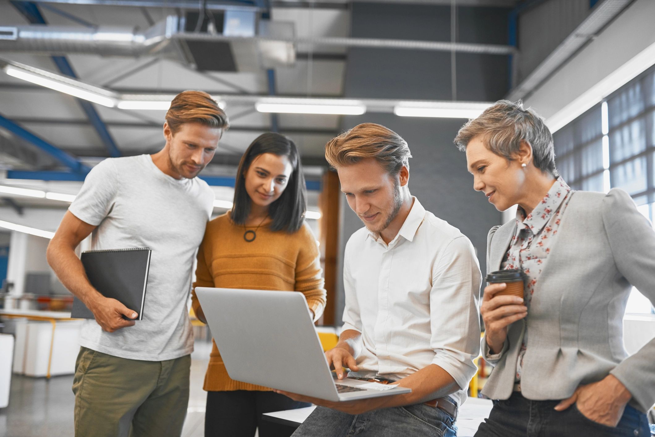 Client success lead sharing updates on a laptop